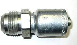 A close up of a metal hose connector on a white surface.
