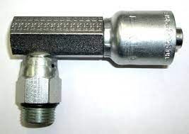 A close up of a hydraulic hose connector on a white surface.