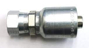 A close up of a metal hose connector on a white surface.