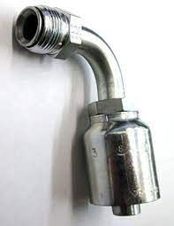 A close up of a hose fitting on a white surface.