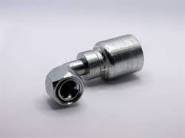 A close up of a hydraulic hose fitting on a white surface.