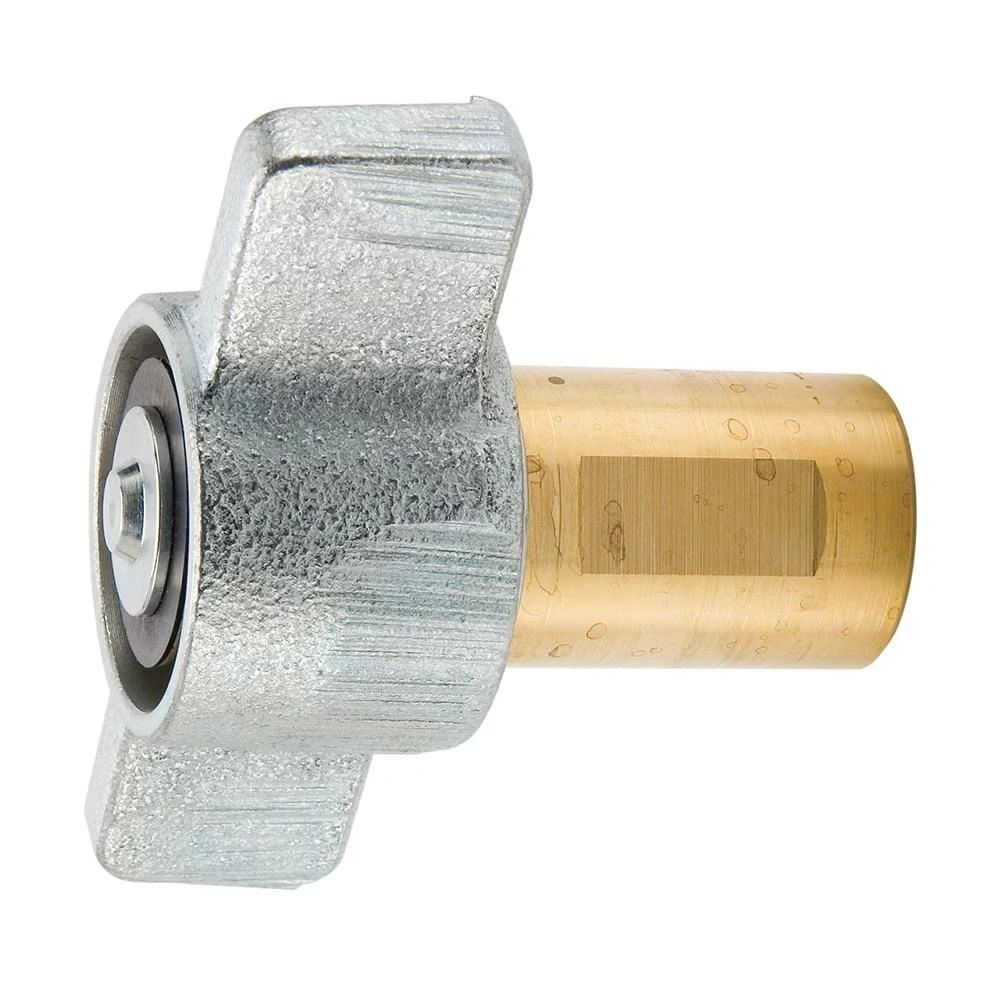 A close up of a metal and brass object on a white background.