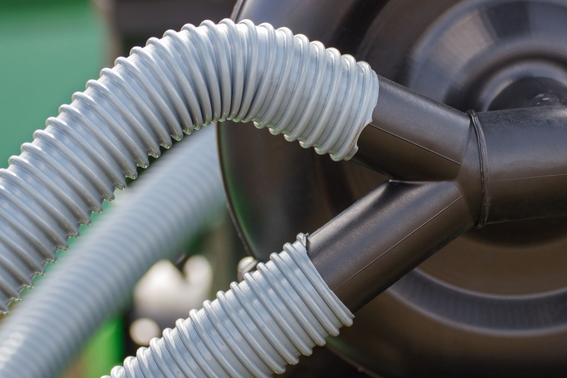 A close up of a hose attached to a black object