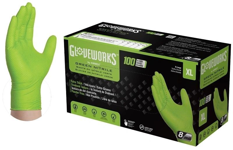 A box of green nitrile gloves next to a green hand.