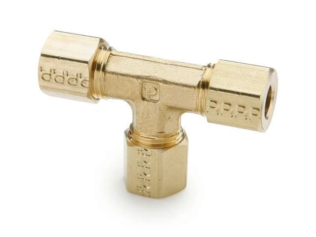 A close up of a brass tee on a white background