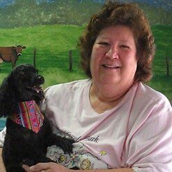 Dog and her owner — Pet Grooming in Lenoir, NC