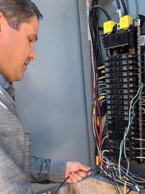 electrical contractor working on a panel