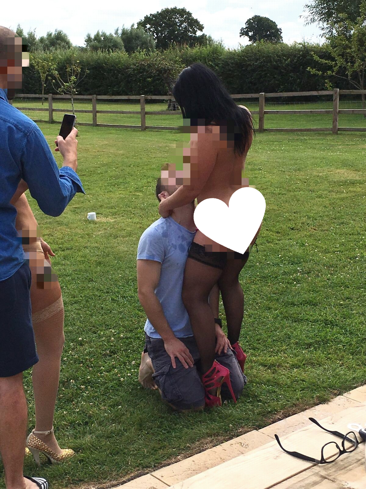 Nude hostess pouring champagne down her breasts