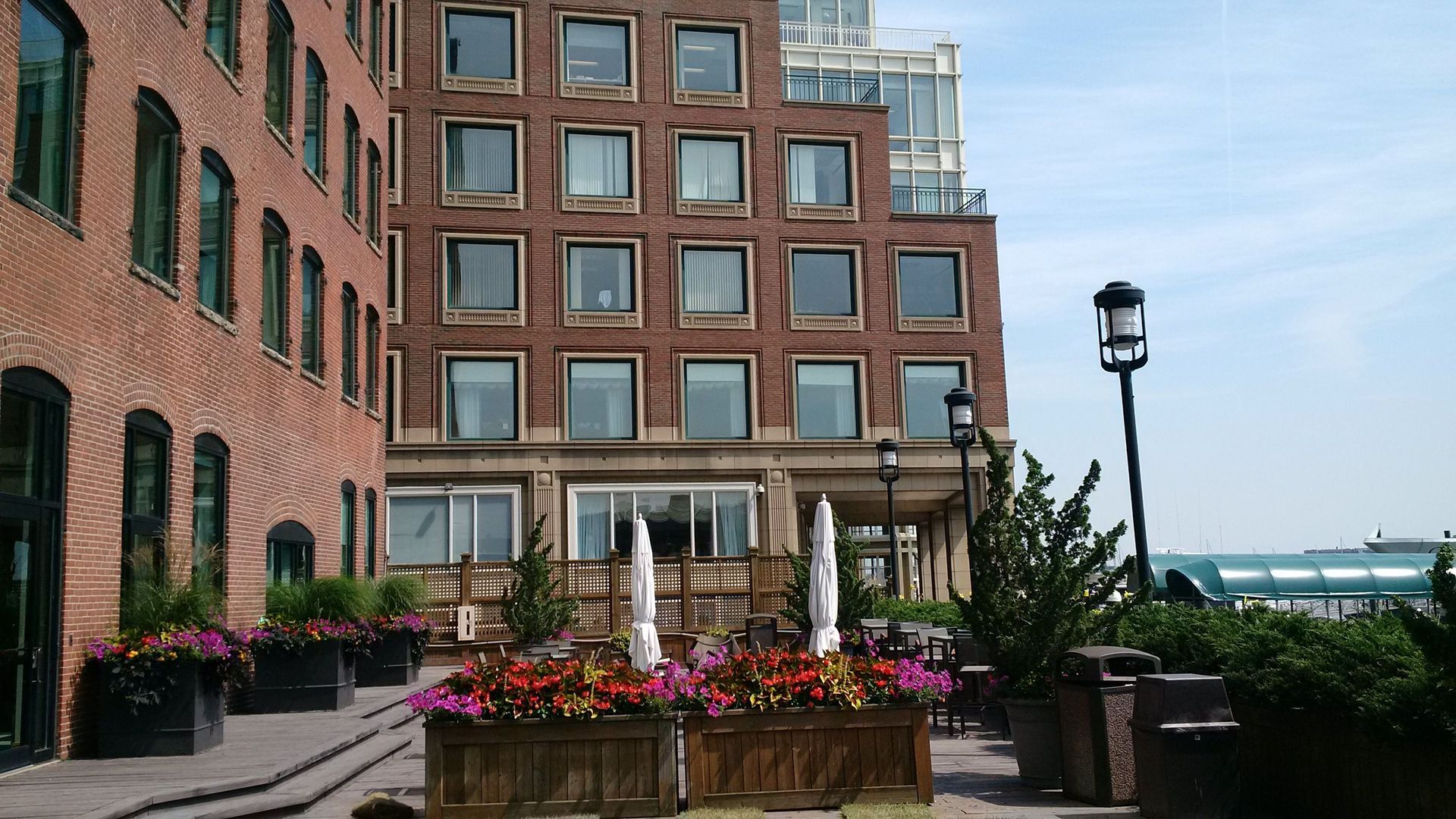 A large brick building with a fountain in front of it