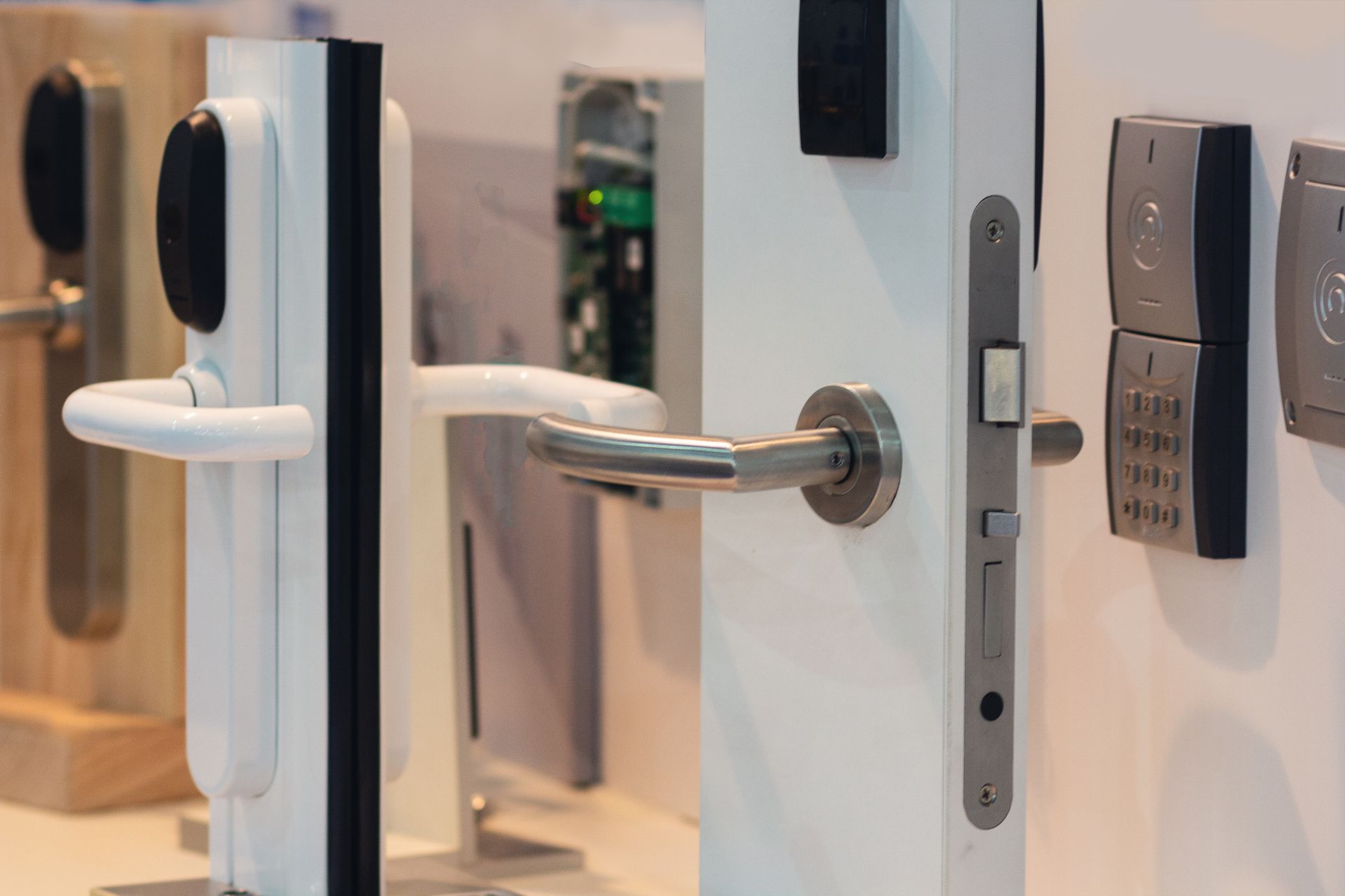 A variety of modern door locks and handles mounted on display panels. A variety of modern door locks and handles mounted on display panels.