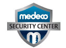 Medeco Security Center logo: Blue shield with 