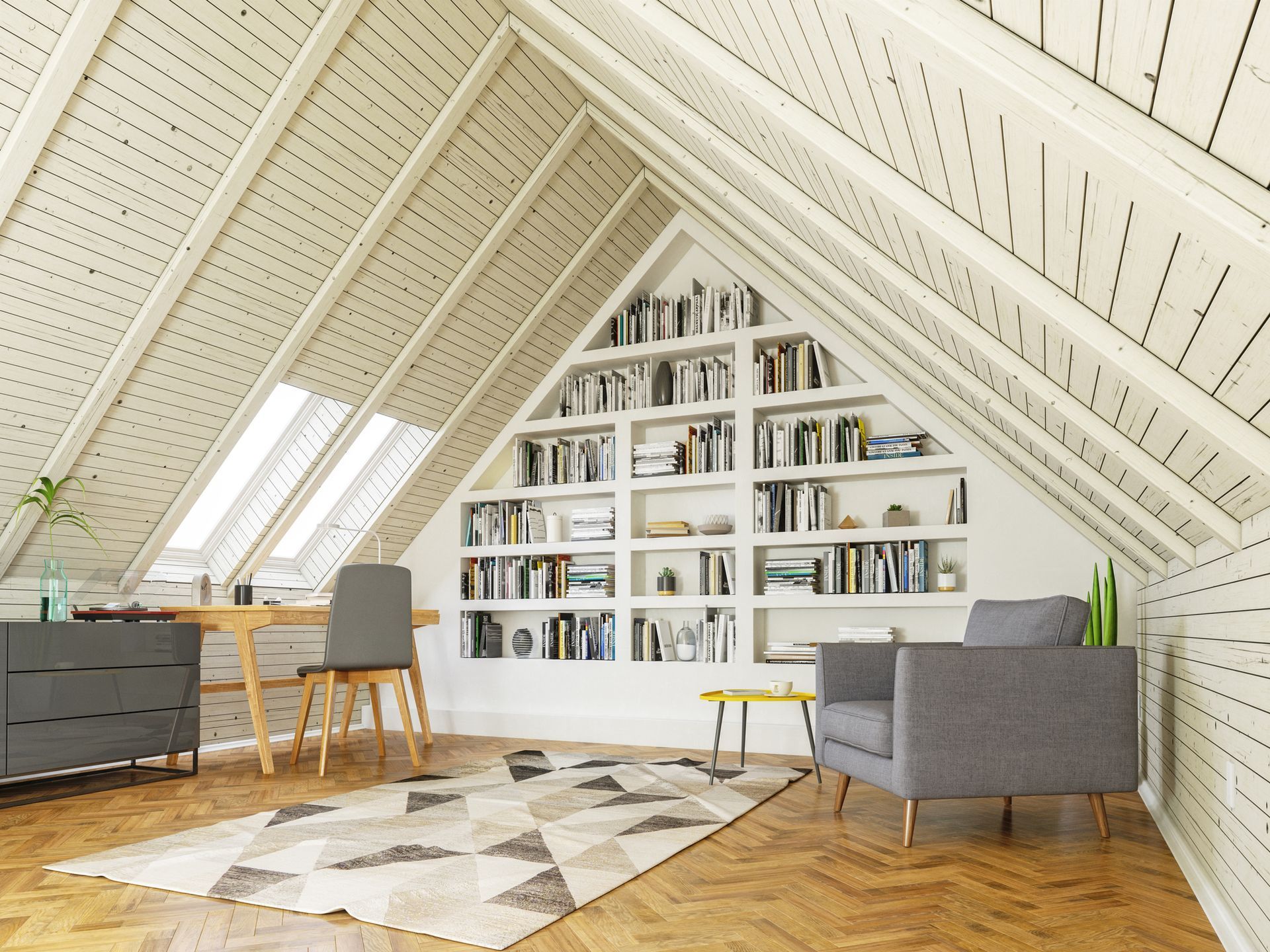 An attic with a triangle shaped bookshelf filled with books.