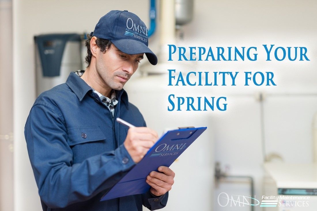 A man is preparing his facility for spring by writing on a clipboard.