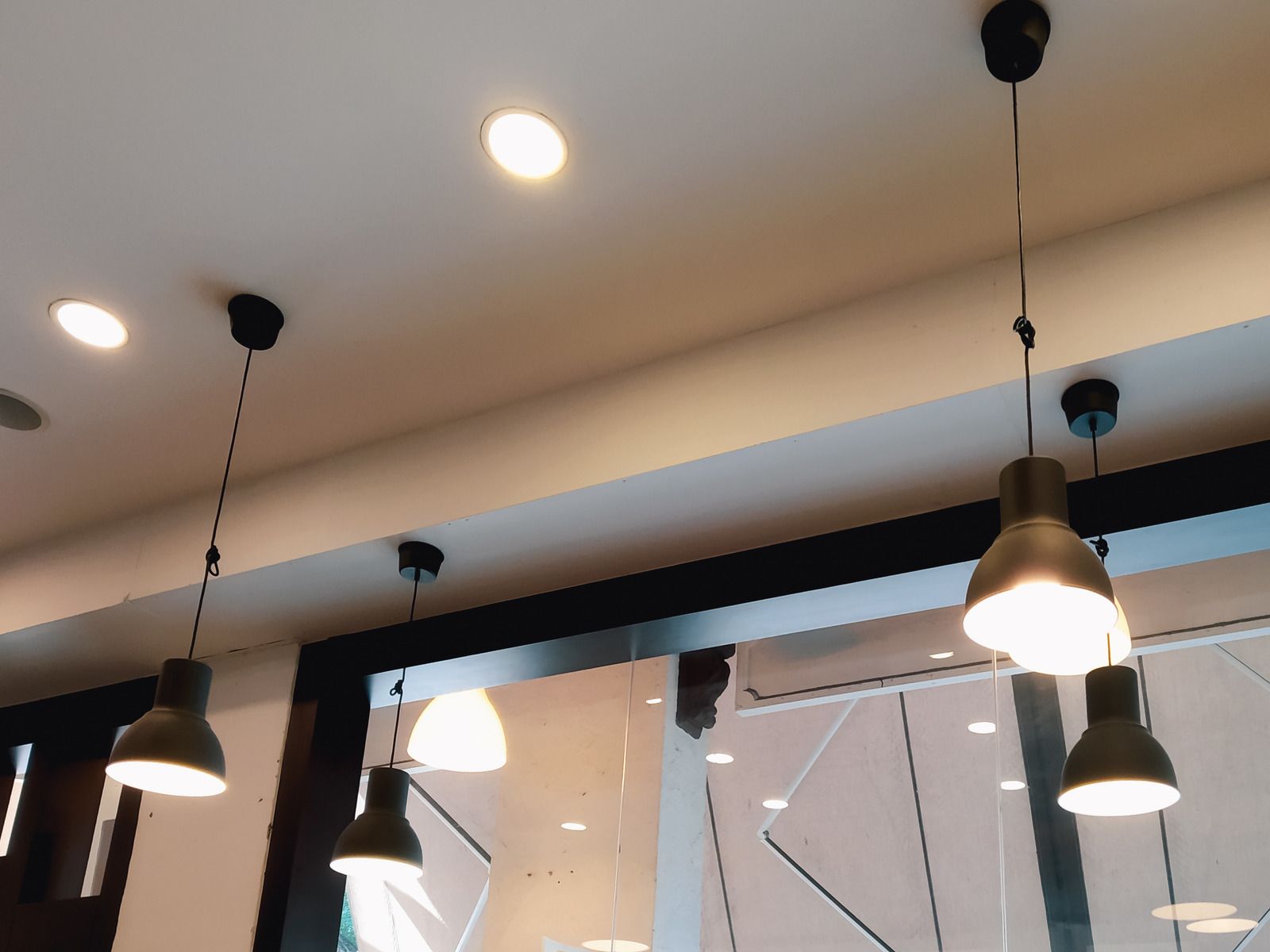 A ceiling with a lot of lights hanging from it