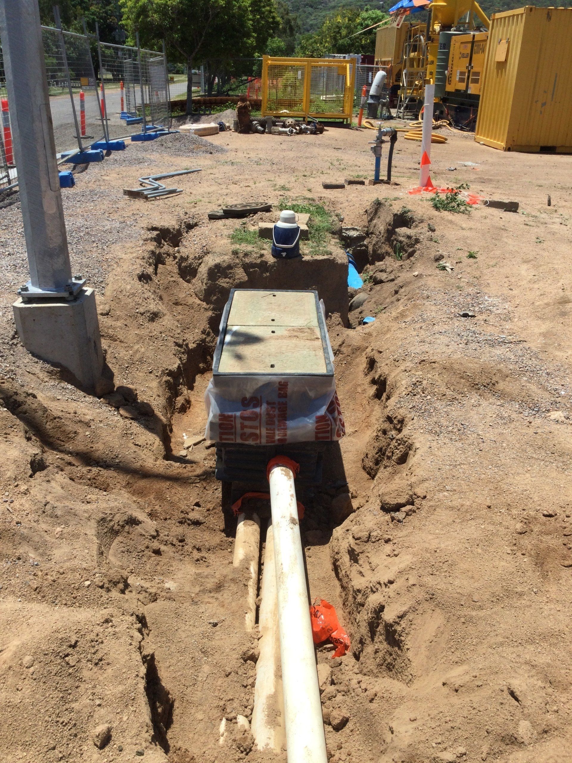 A Parked Excavator — Providing Communications and Hydro Excavation Services in Townsville, QLD