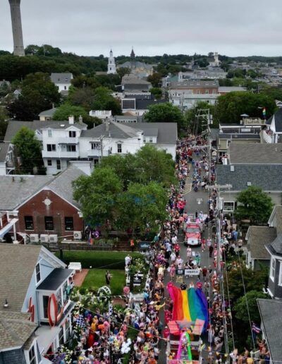 An aerial view of a parade in a small town