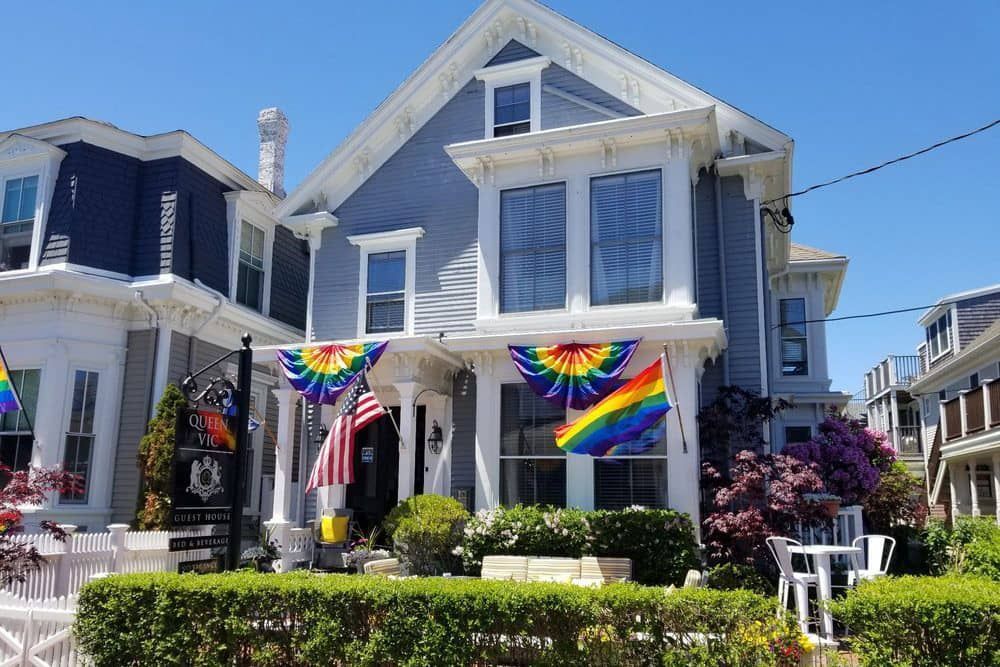 A house with a rainbow flag on the front of it.