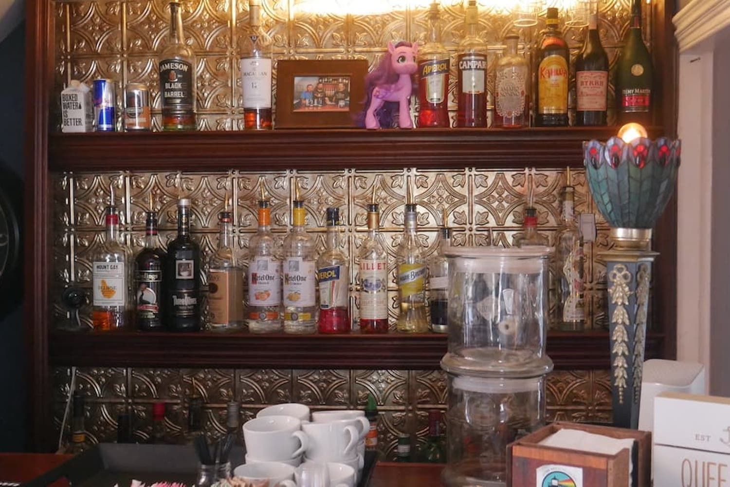 A shelf full of bottles including one that says ' ruff ' on it