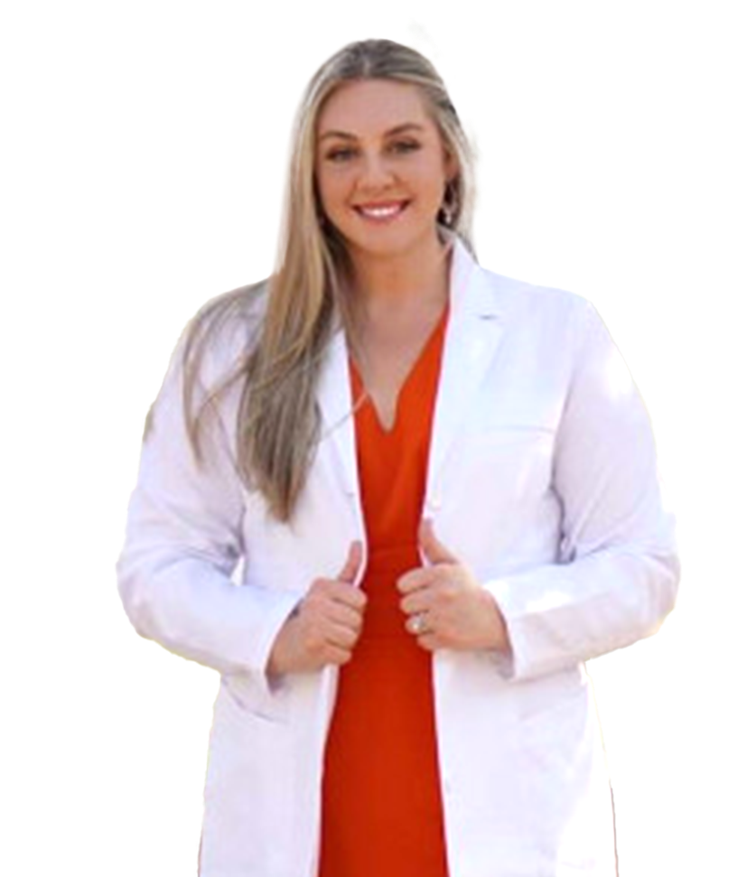 A person wearing a white lab coat over an orange dress, smiling and gesturing with thumbs held up.