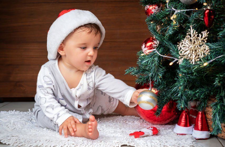 Baby Playing with Holiday Decorations