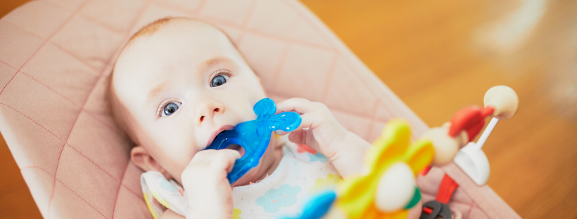 Baby playing with teething toy