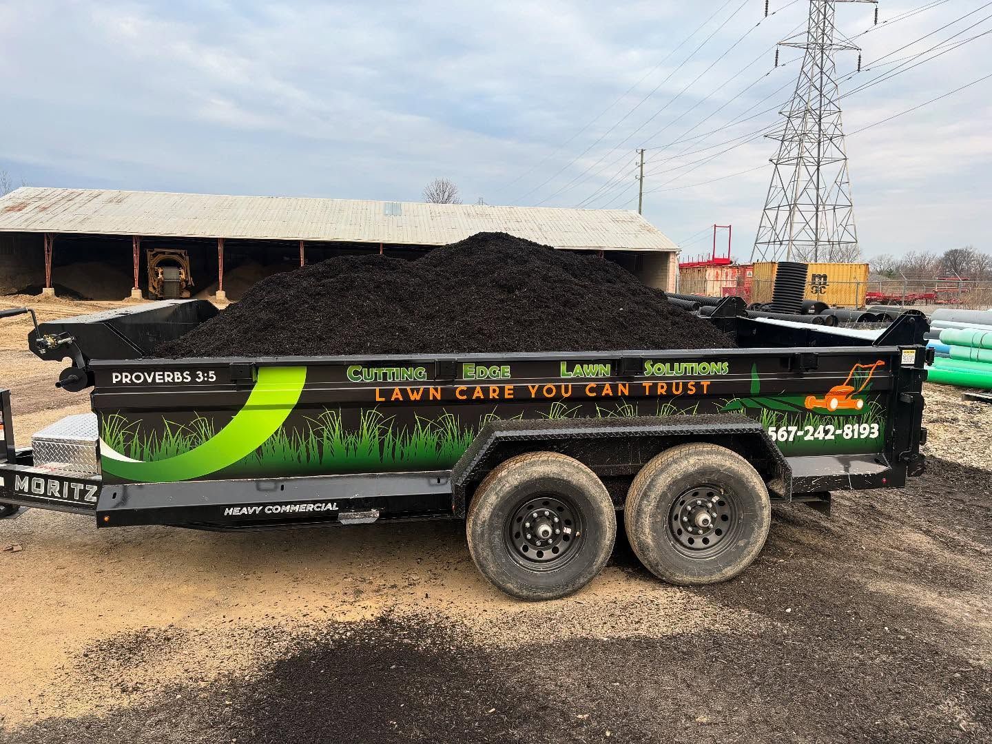 Black-filled landscaping trailer, 