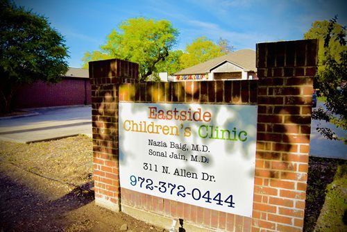 Brick sign for Eastside Children's Clinic, including doctor names and address at 311 E. Allen Dr., 972-372-0444.