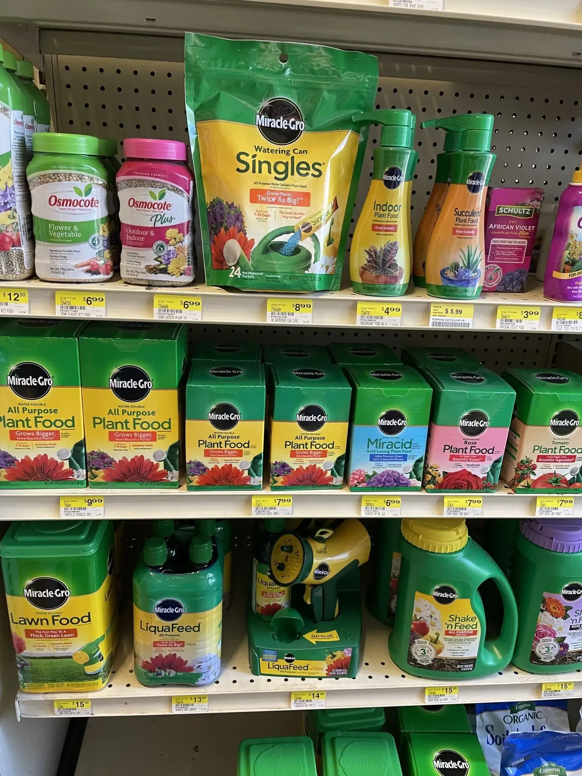 A store shelf filled with a variety of gardening products.