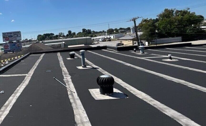 The roof of a building with a lot of vents on it.