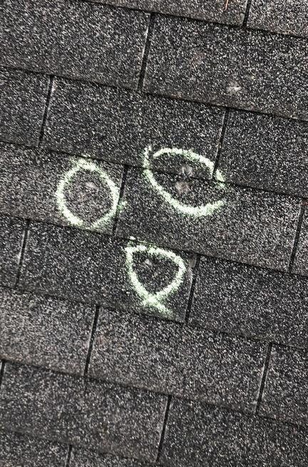 A close up of a roof with circles and hearts drawn on it.