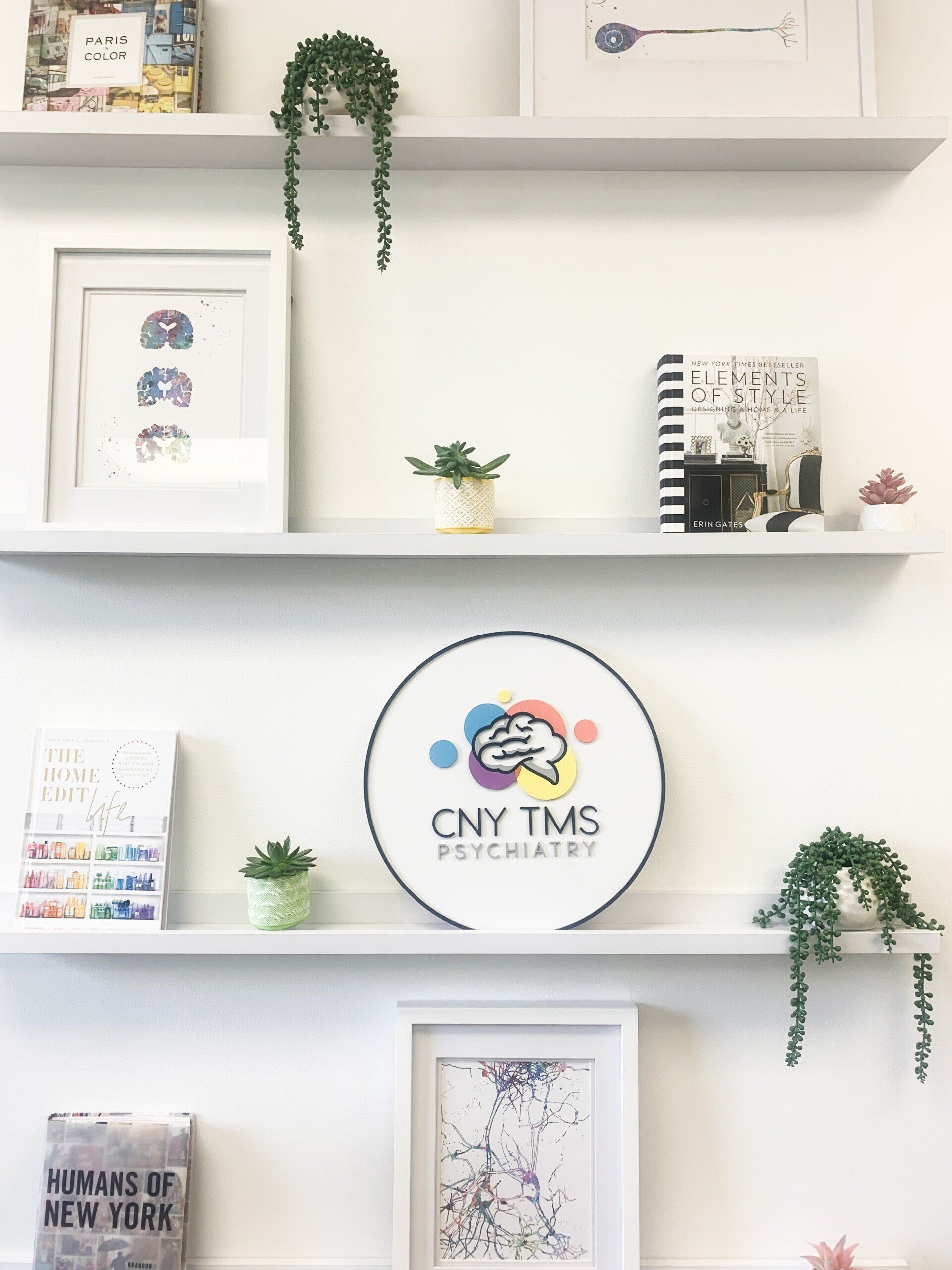 A shelf with a sign that says cny tms on it.