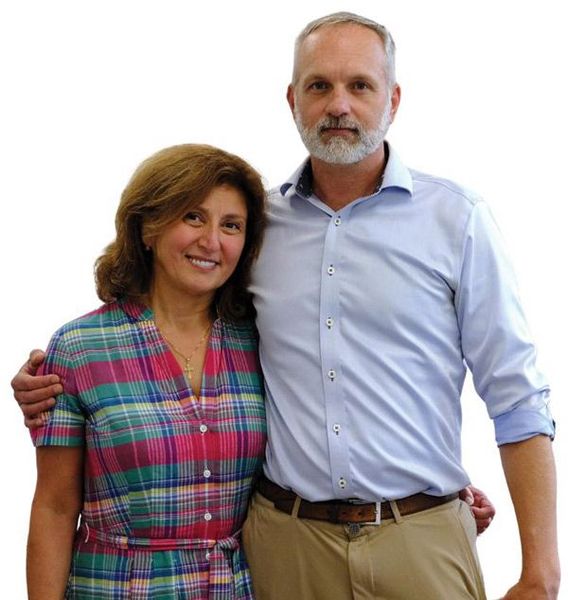 A man and a woman are posing for a picture together