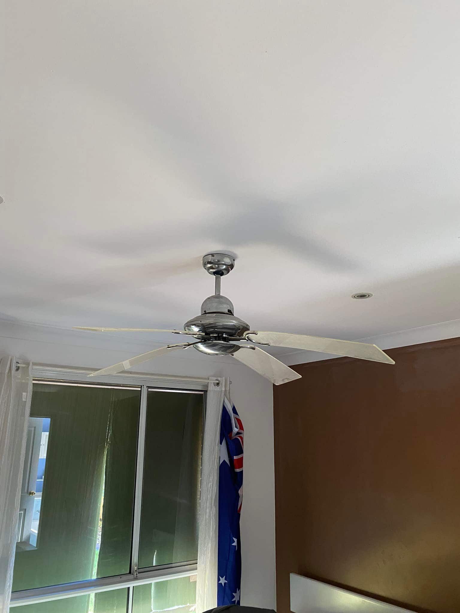 Ceiling Fan With Chrome Finish, Four Blades, Mounted on White Ceiling — SparkSafe Electrical in Dapto, NSW