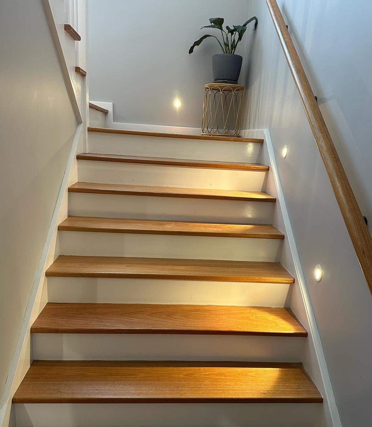 Wooden Staircase With White Risers — SparkSafe Electrical in Dapto, NSW