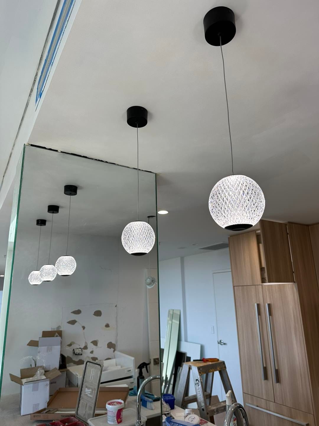 Three Pendant Lights With Textured Globes Hanging From a Ceiling — SparkSafe Electrical in Dapto, NSW