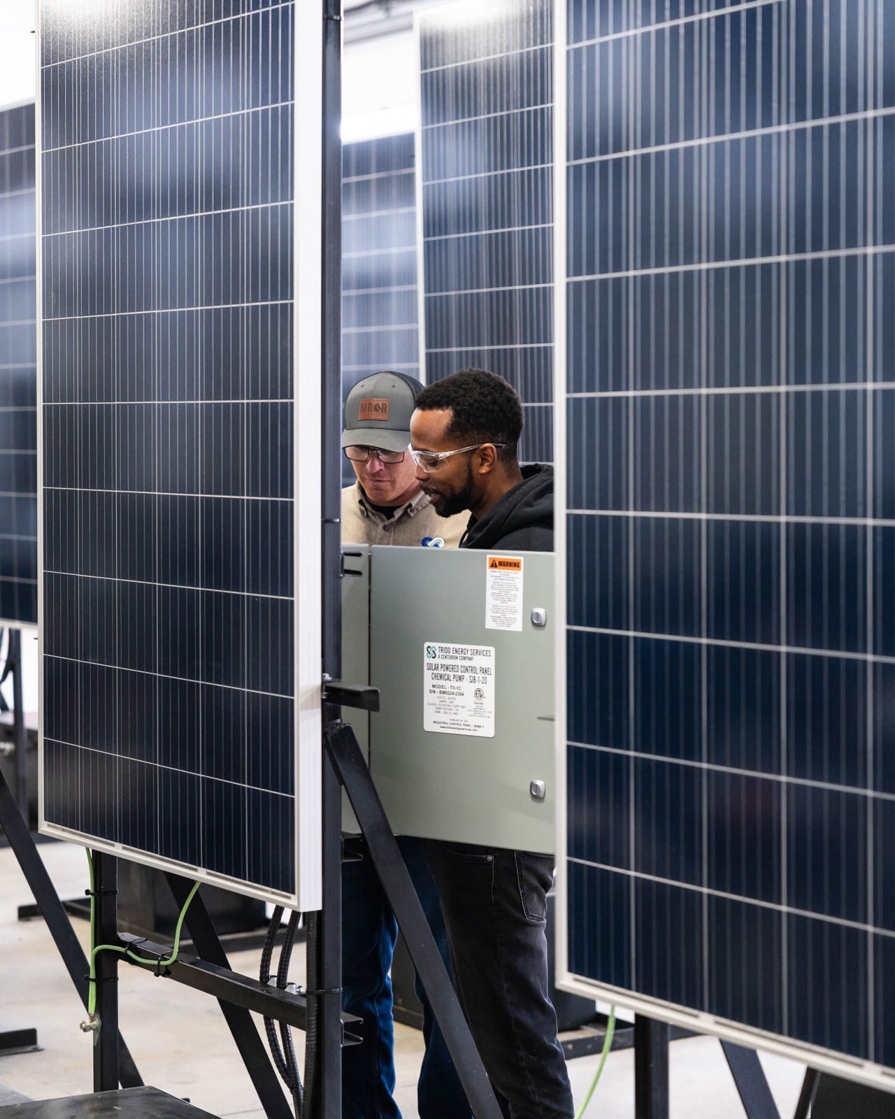 Trido engineers reviewing solar technology equipment