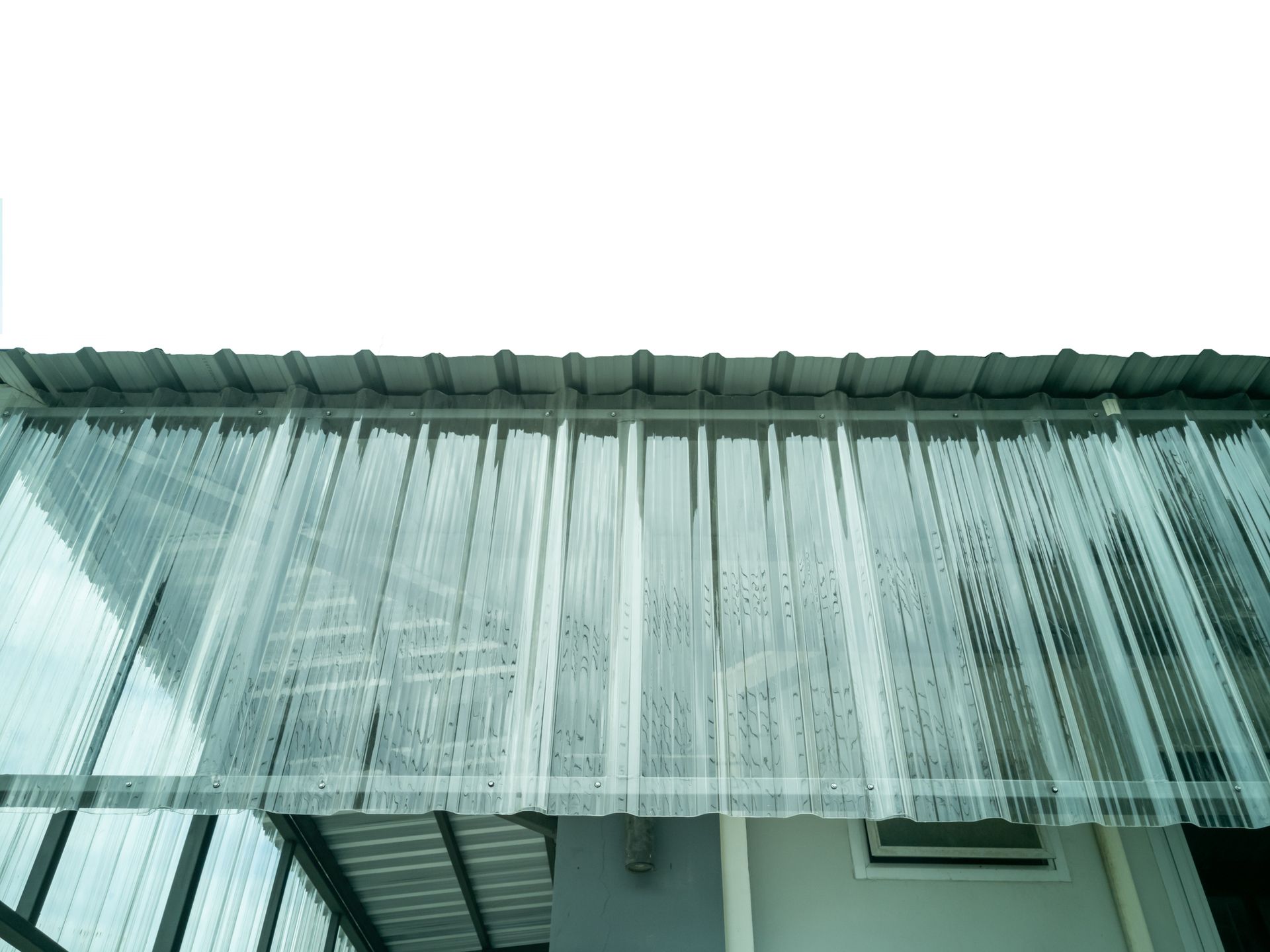 A fibreglass translucent roof on the side of a building.