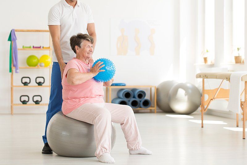 Shoulder Pain — Senior Woman Exercising in Lynnwood, WA