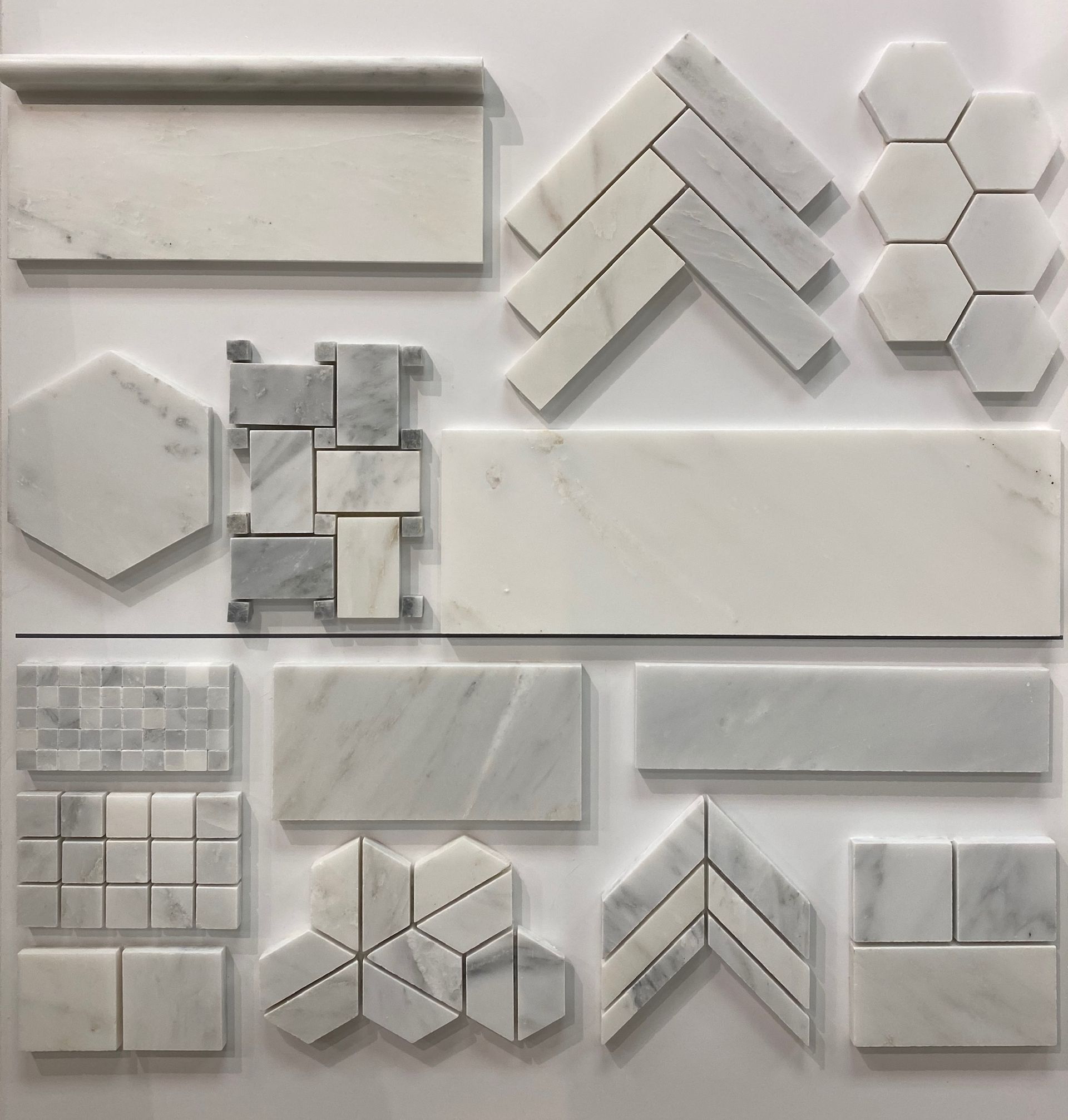 There are many different types of tiles on the wall.