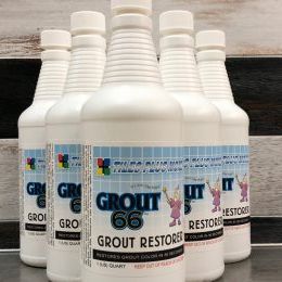 A group of bottles of grout 66 are sitting on a table.