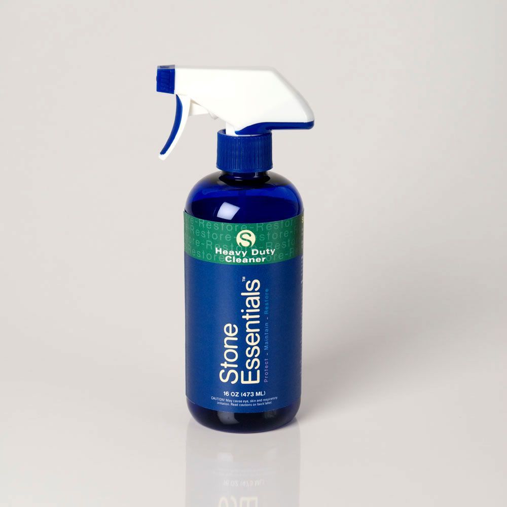 A blue bottle of stone essentials heavy duty cleaner