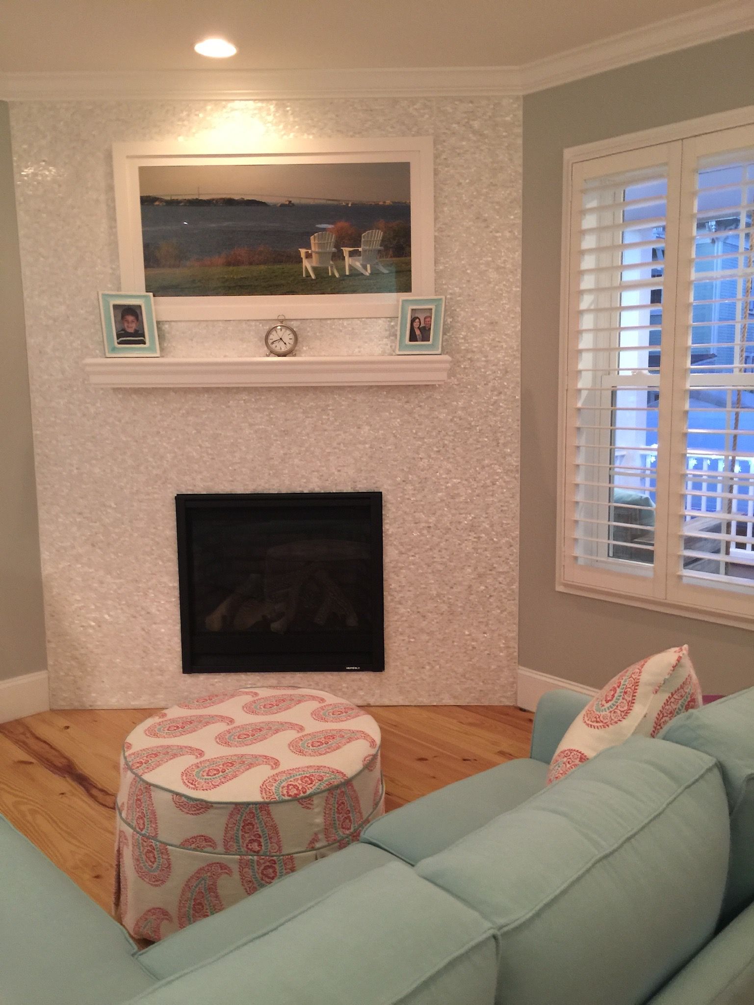 A living room with a fireplace and a couch