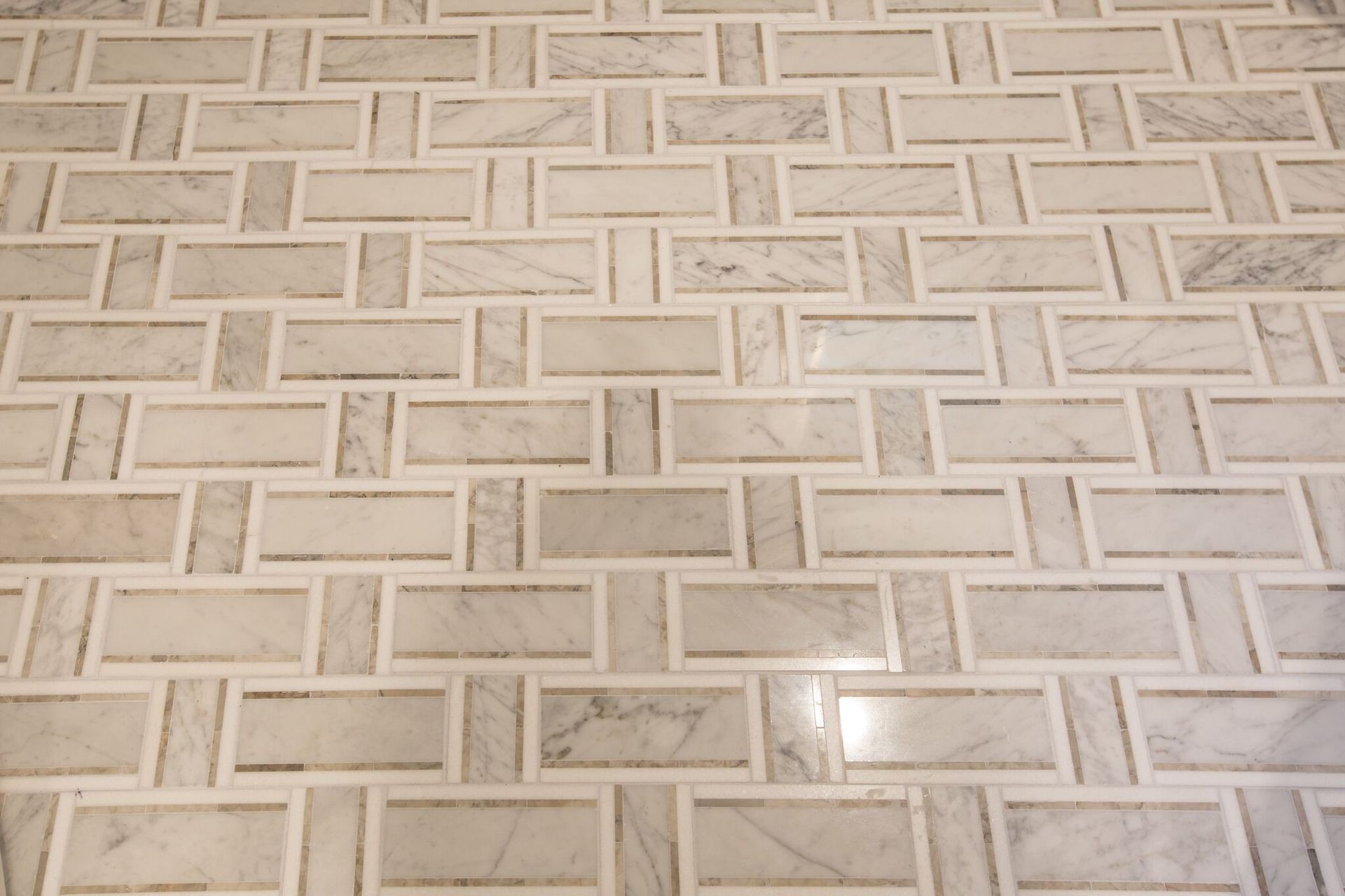 A white tile floor with a geometric pattern