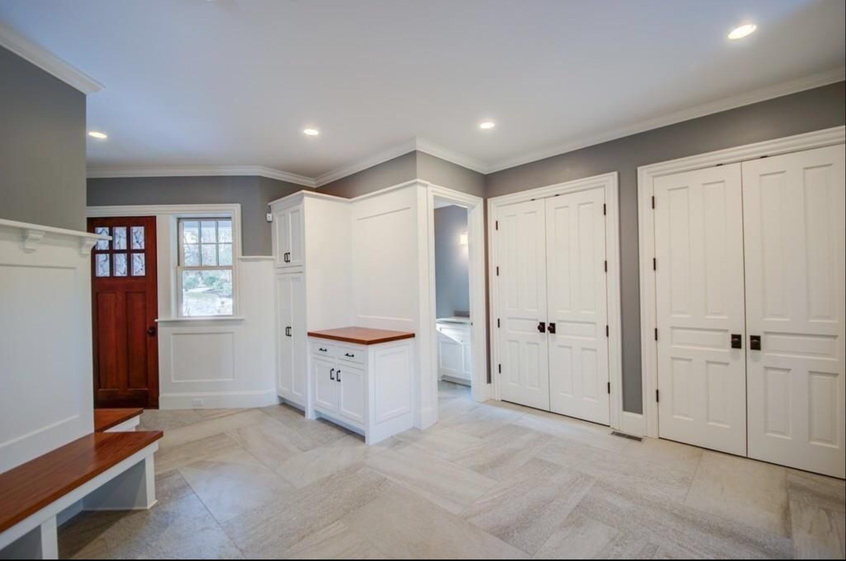 There is a bench in the middle of the room.