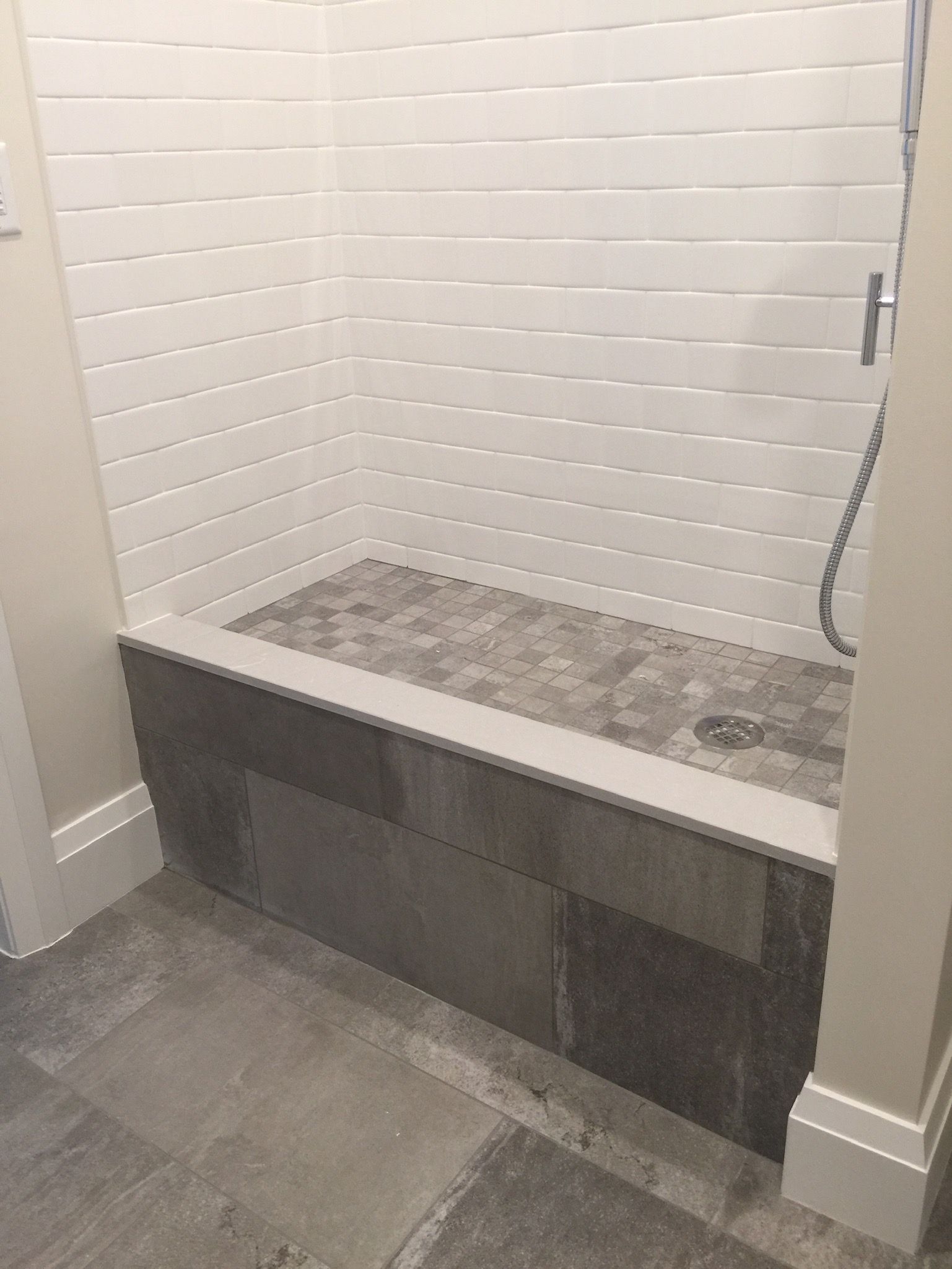 A bathroom with a bathtub and a shower.