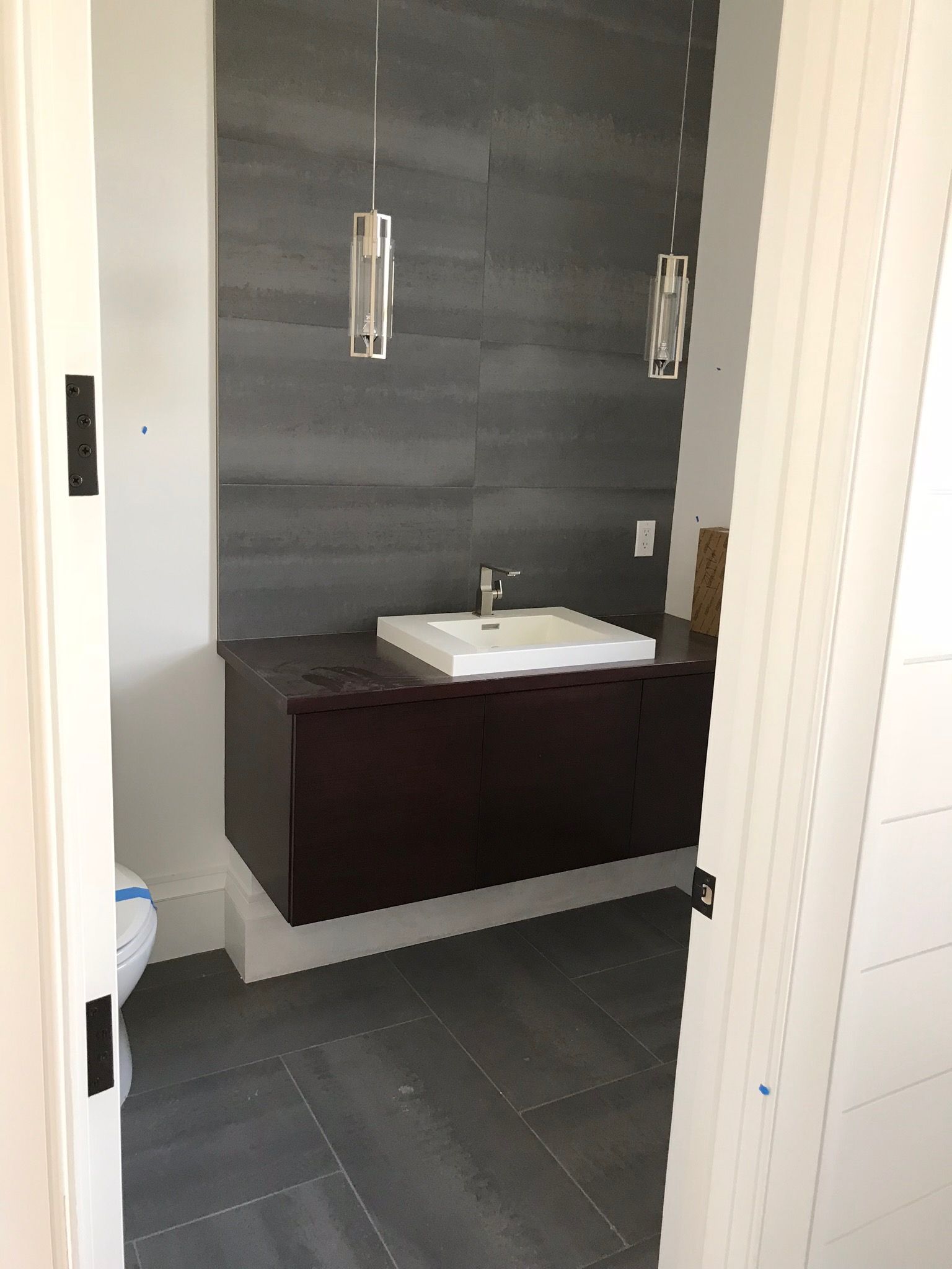 A bathroom with a sink and a toilet in it