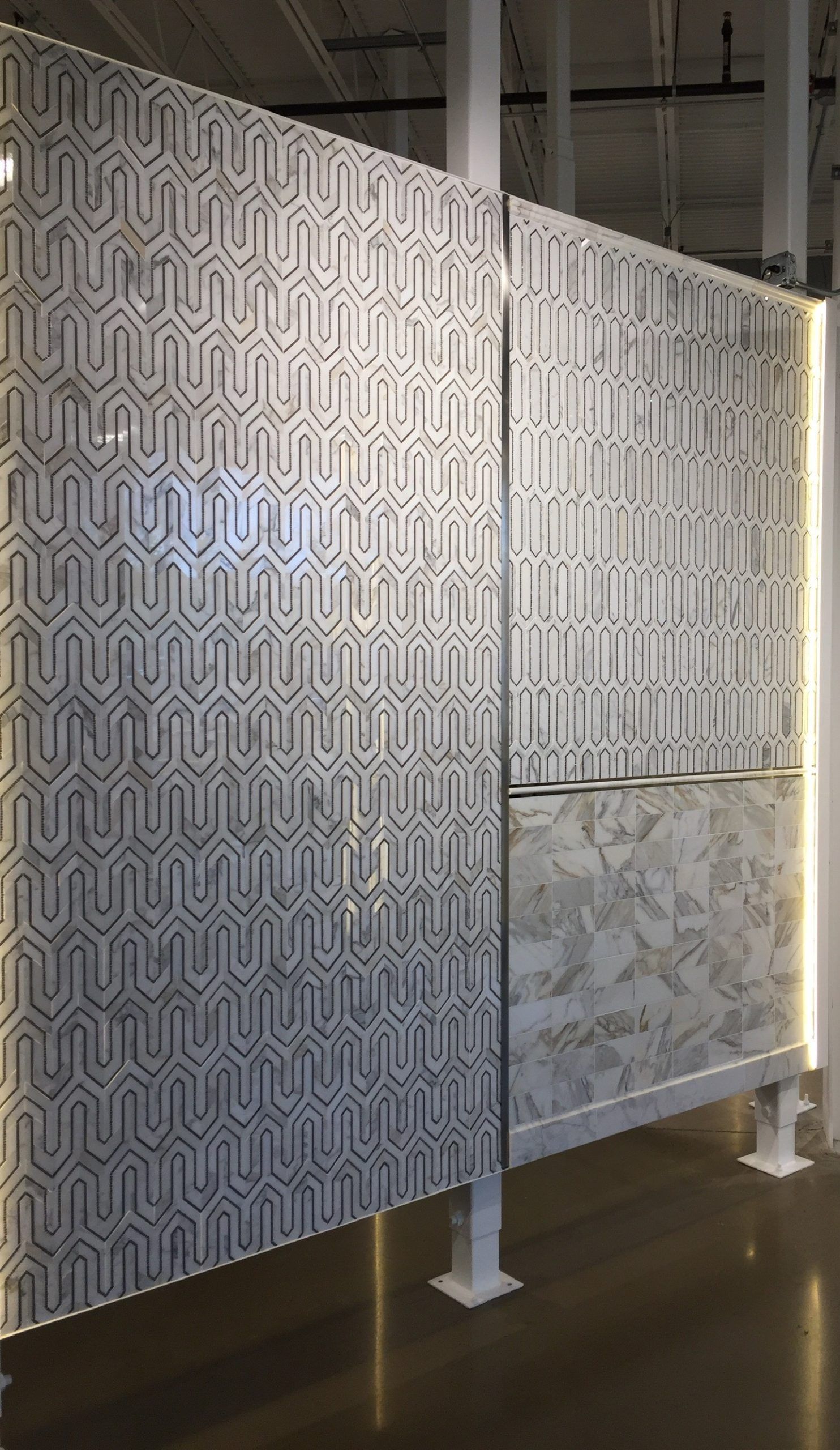 A room divider with a geometric pattern on it.