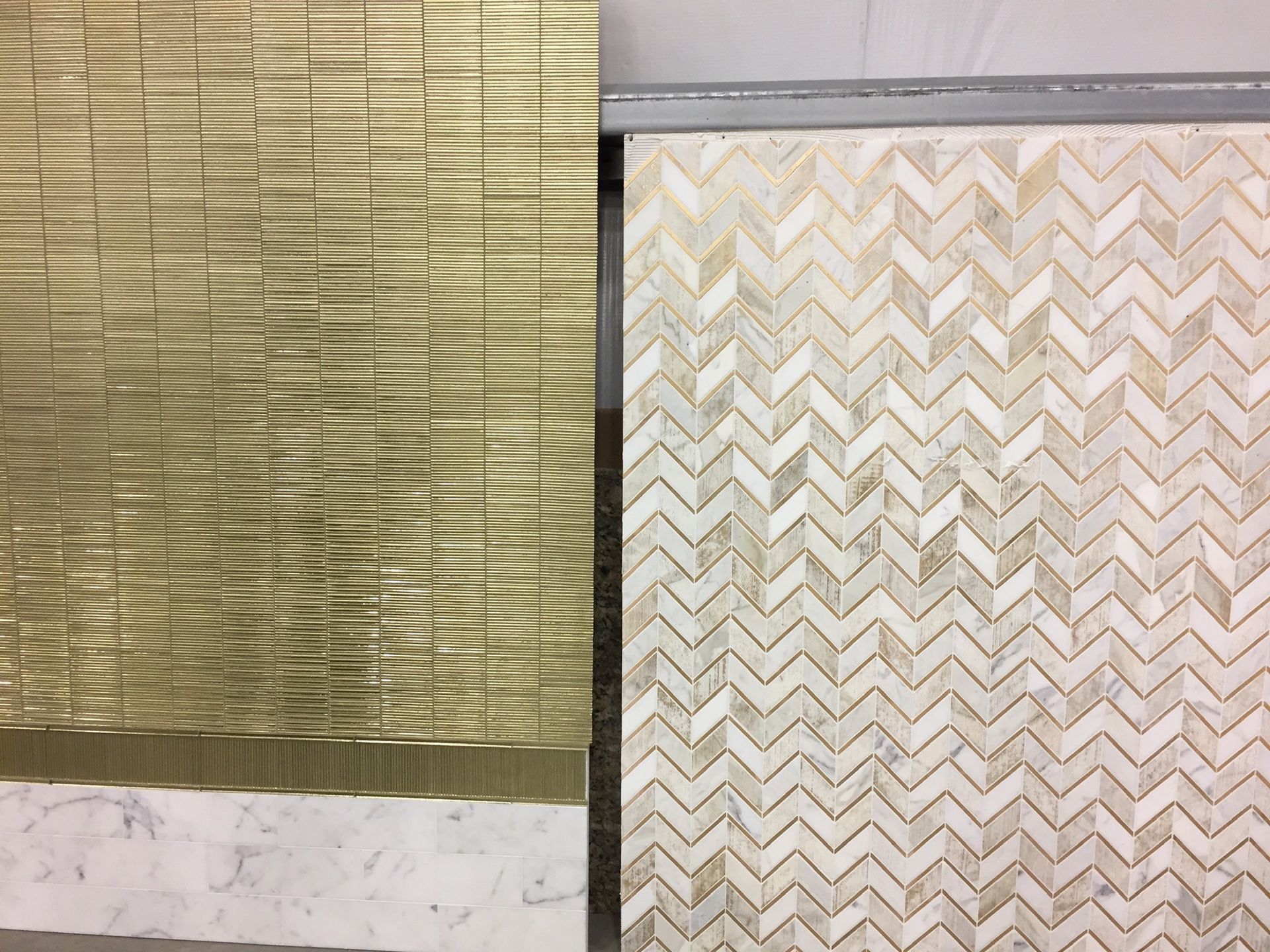 A gold and white tile with a herringbone pattern
