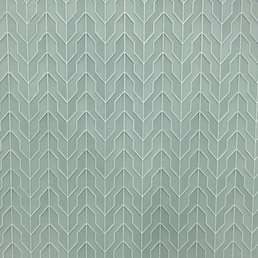 A close up of a tile with a herringbone pattern on it.