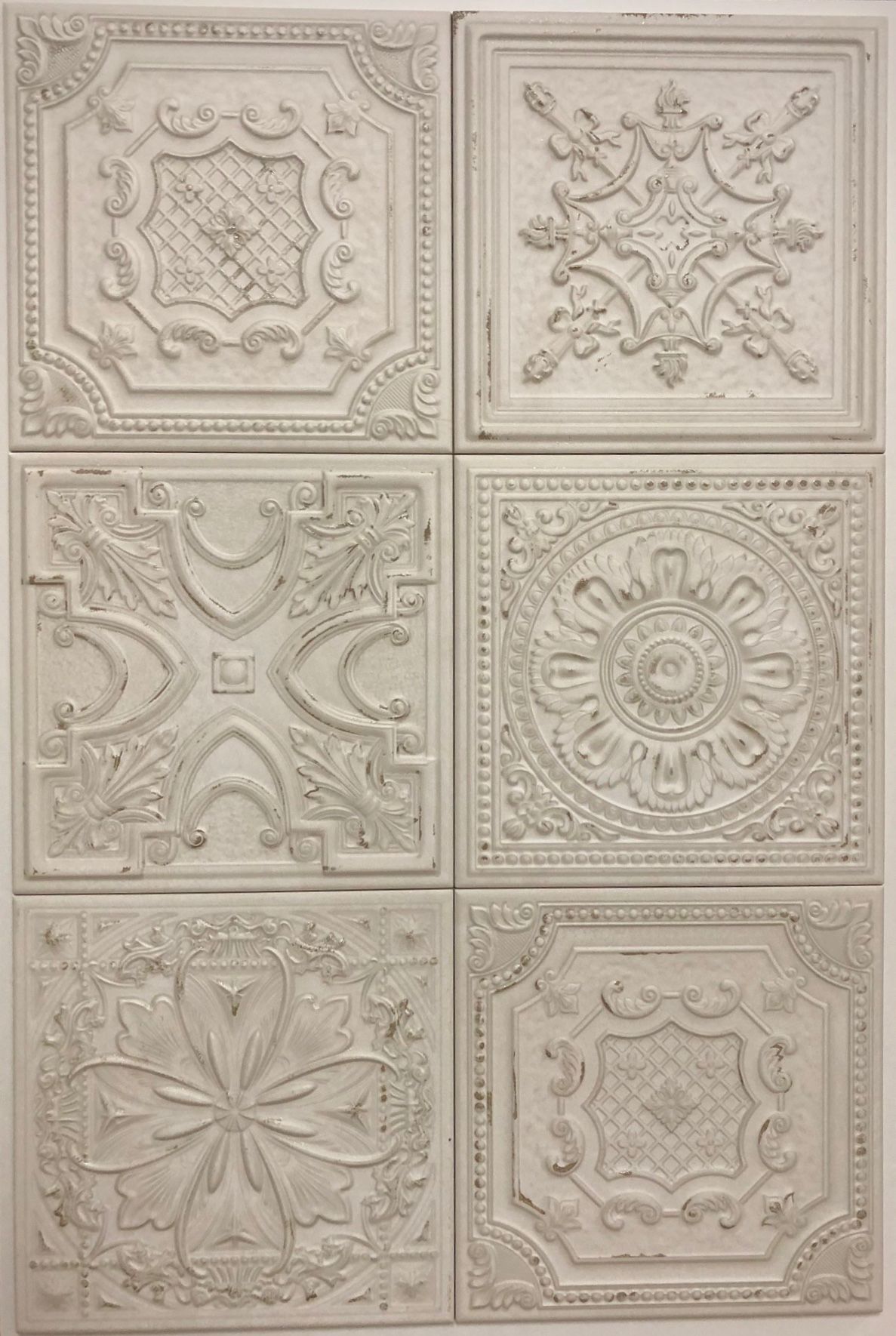 A set of white tiles with different designs on them.